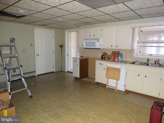 kitchen with white appliances, sink, a baseboard heating unit, and white cabinets