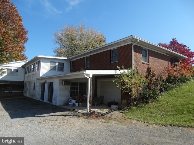 back of house with a carport