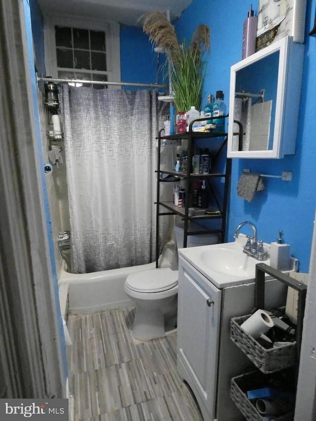 full bathroom with vanity, toilet, and shower / bathtub combination with curtain