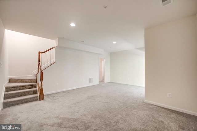 spare room featuring carpet floors