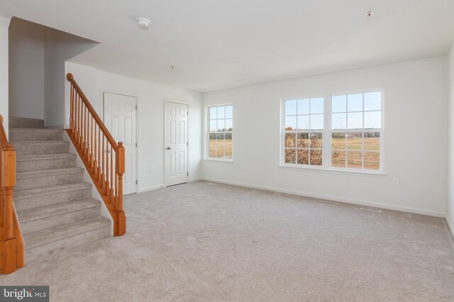 empty room with light colored carpet