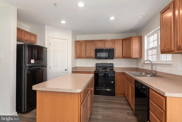 kitchen featuring sink, black appliances, a center island, and dark hardwood / wood-style flooring