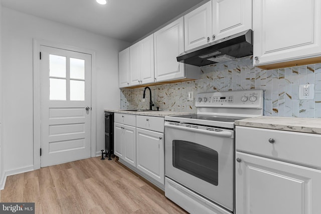 kitchen with light hardwood / wood-style floors, white cabinets, sink, and white range with electric cooktop