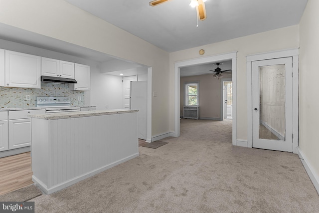 kitchen with white cabinetry, white electric range, tasteful backsplash, and light colored carpet