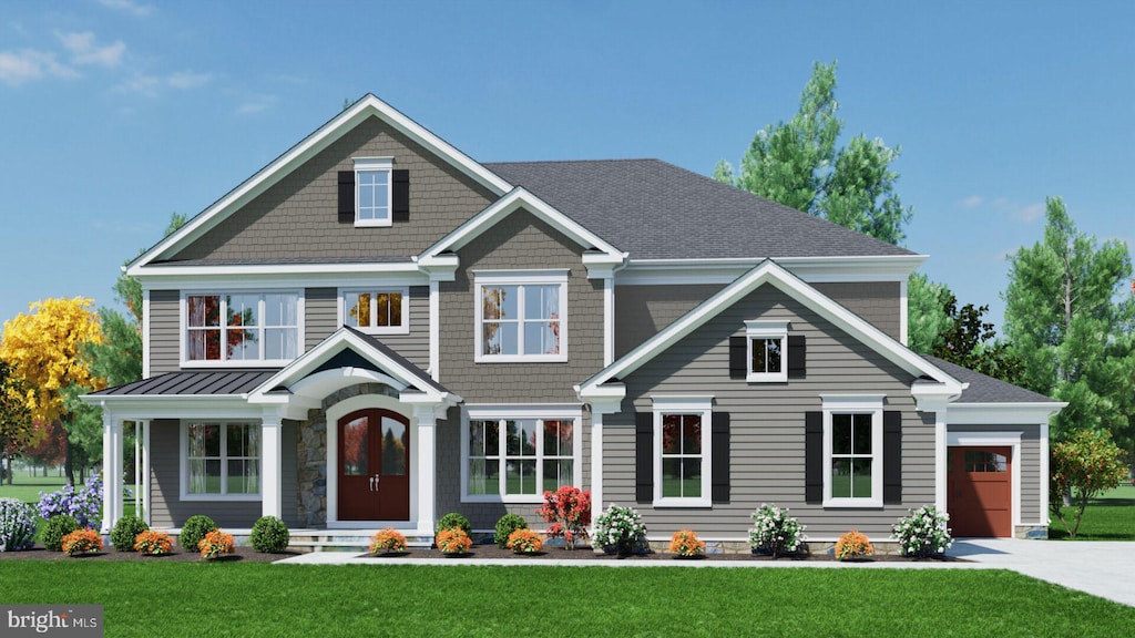 craftsman-style house featuring a garage and a front lawn