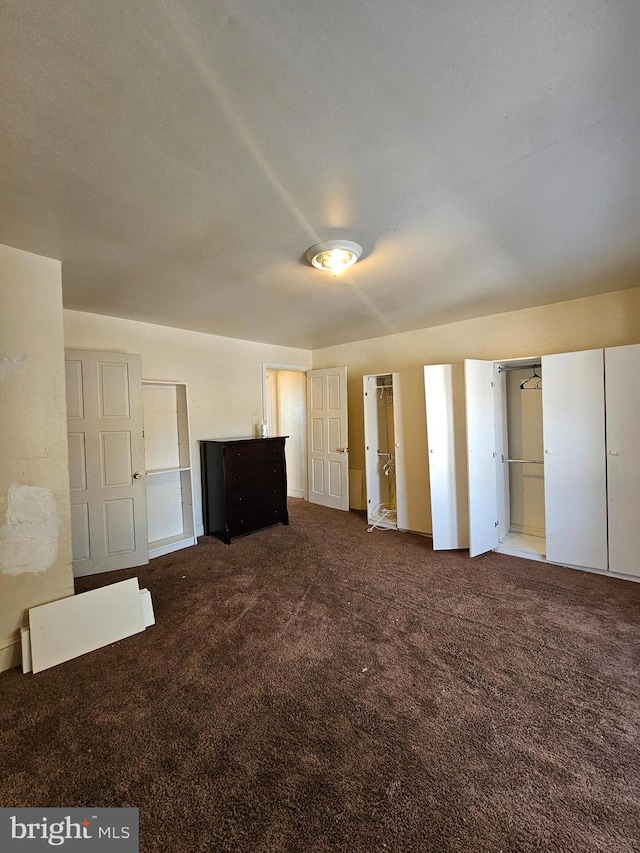 unfurnished bedroom featuring carpet floors