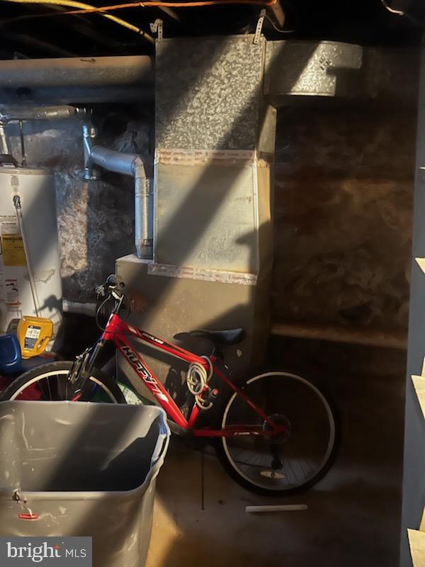 utility room with water heater