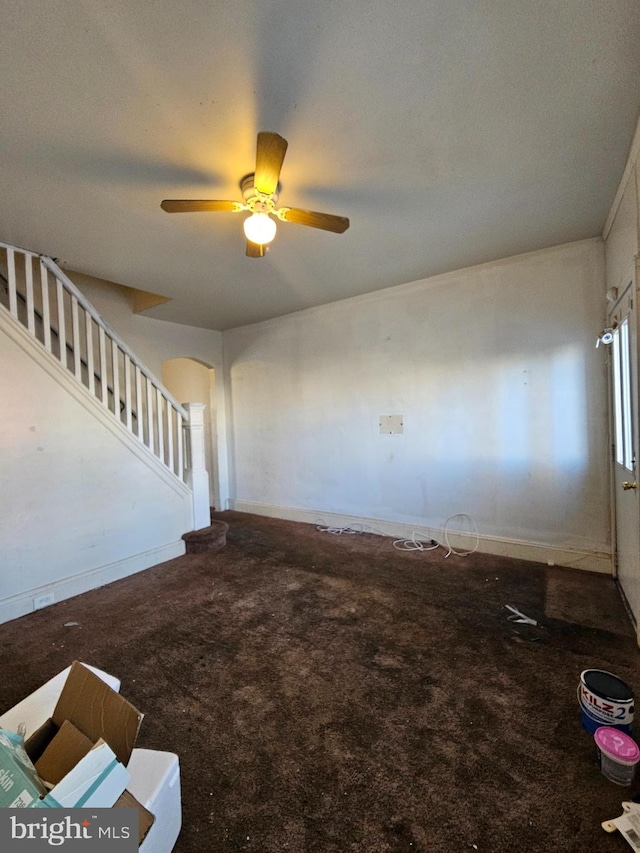 interior space featuring ceiling fan and carpet floors