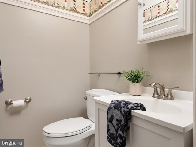 bathroom with vanity and toilet