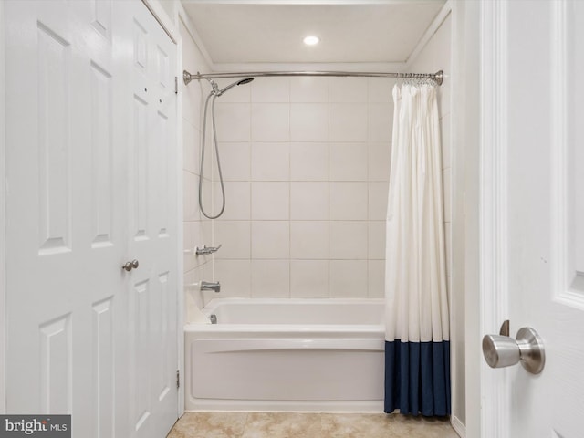 bathroom with shower / tub combo with curtain