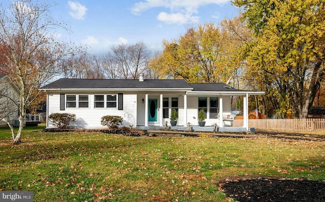 single story home with covered porch and a front lawn