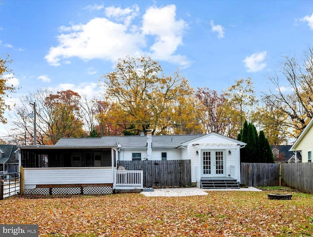 back of property featuring a sunroom