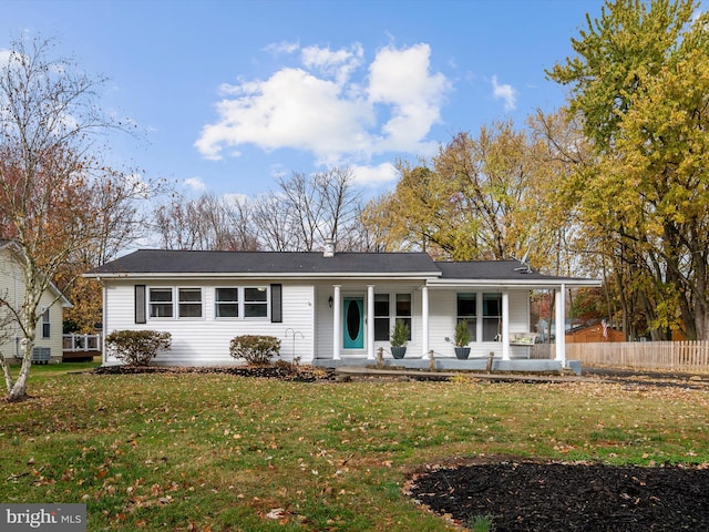 ranch-style home with a front lawn and a porch