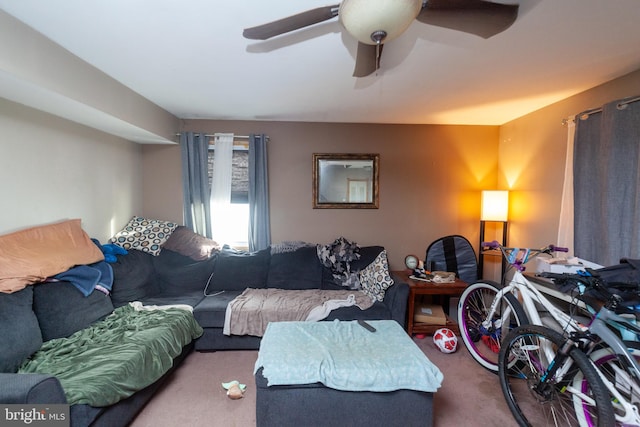 carpeted living room featuring ceiling fan