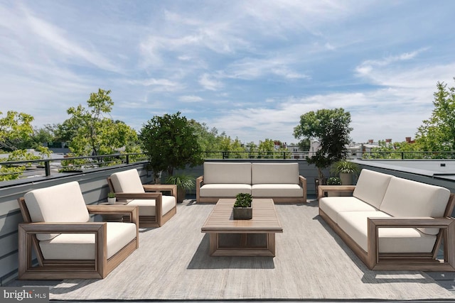 view of patio / terrace with a balcony and outdoor lounge area