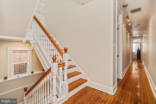 stairway featuring hardwood / wood-style floors