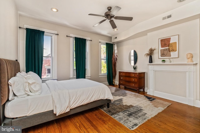 bedroom featuring wood-type flooring and ceiling fan