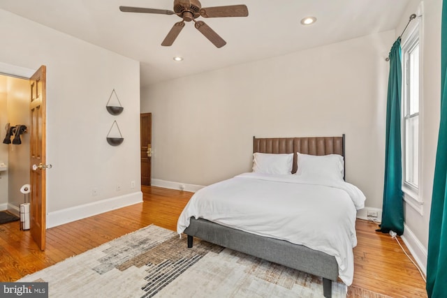 bedroom featuring ceiling fan and hardwood / wood-style floors