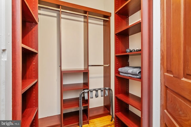 spacious closet with light hardwood / wood-style floors