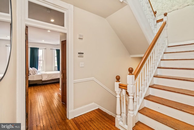 staircase featuring hardwood / wood-style flooring