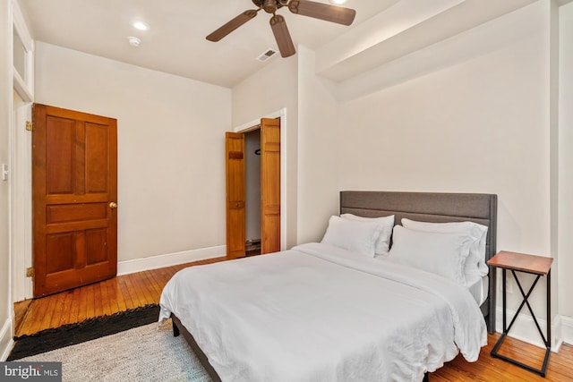 bedroom with light wood-type flooring and ceiling fan