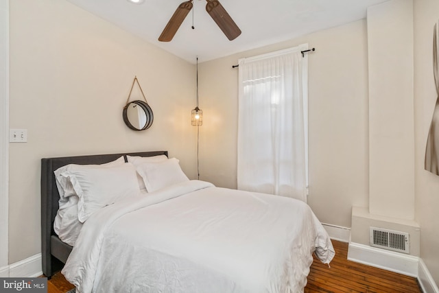 bedroom featuring wood-type flooring and ceiling fan