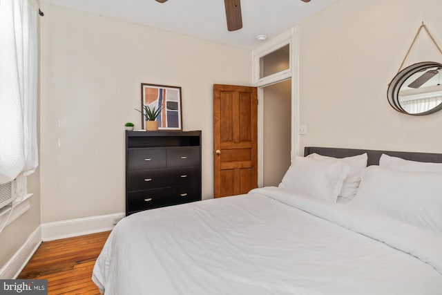 bedroom featuring hardwood / wood-style flooring and ceiling fan