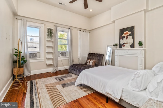 bedroom featuring hardwood / wood-style flooring and ceiling fan