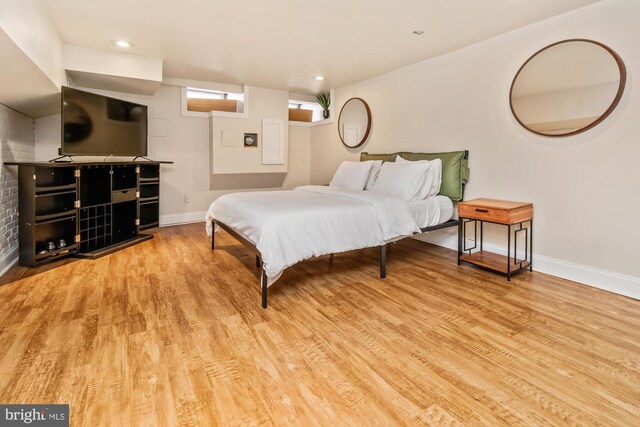 bedroom with light hardwood / wood-style flooring