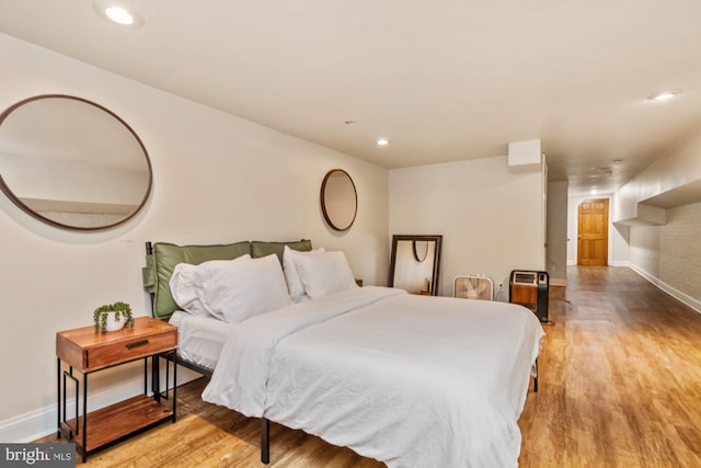 bedroom with light hardwood / wood-style floors