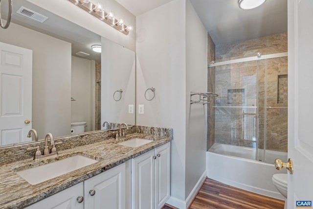 full bath with visible vents, a sink, and toilet