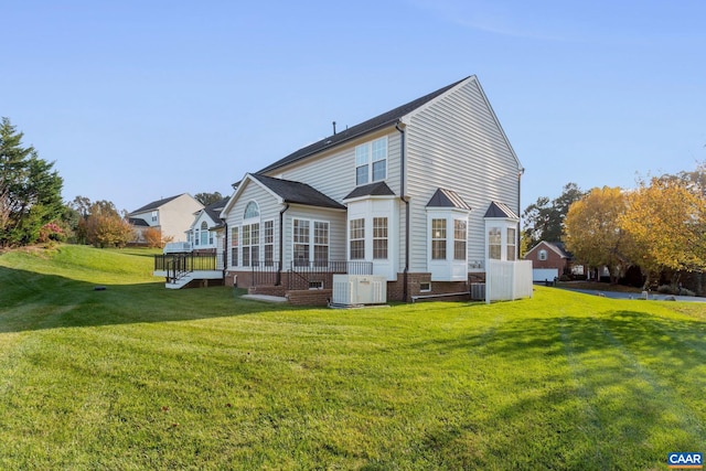 back of house with a deck, a yard, crawl space, and cooling unit