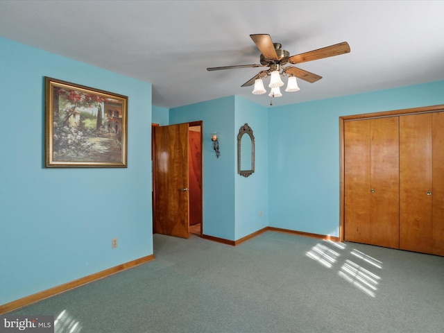 unfurnished bedroom featuring a closet, ceiling fan, and light colored carpet