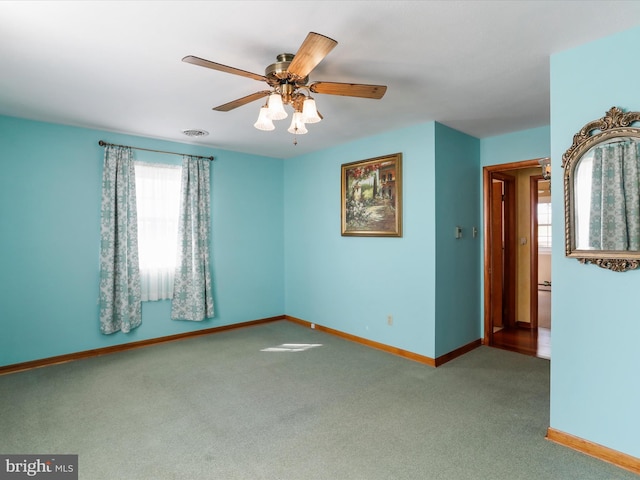 carpeted empty room with ceiling fan