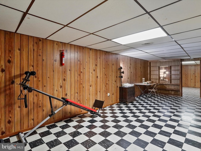 bar with a drop ceiling and wood walls