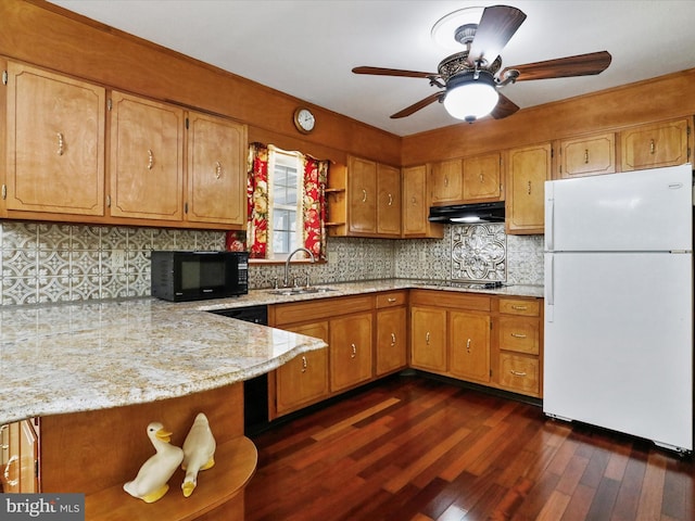 kitchen with sink, dark hardwood / wood-style flooring, kitchen peninsula, gas cooktop, and white refrigerator