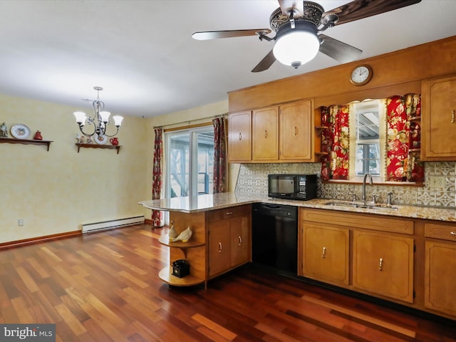 kitchen featuring black appliances, sink, kitchen peninsula, baseboard heating, and dark hardwood / wood-style floors