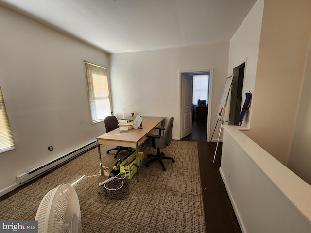 office area with a baseboard radiator and dark hardwood / wood-style floors