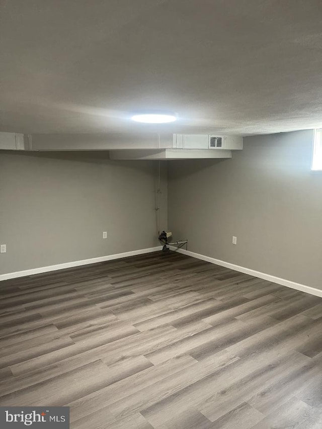 basement with wood-type flooring