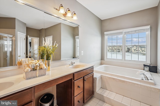 bathroom featuring tile patterned floors, vanity, and separate shower and tub