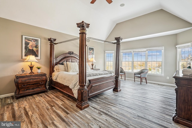 bedroom with hardwood / wood-style floors, ceiling fan, and lofted ceiling