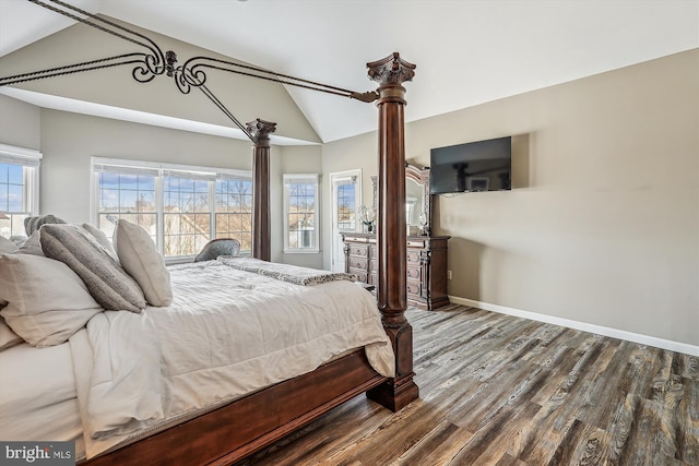 bedroom featuring hardwood / wood-style floors and lofted ceiling