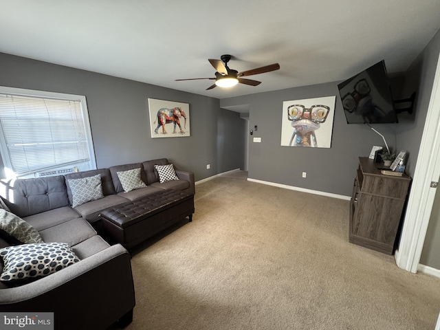 living room with ceiling fan and carpet floors