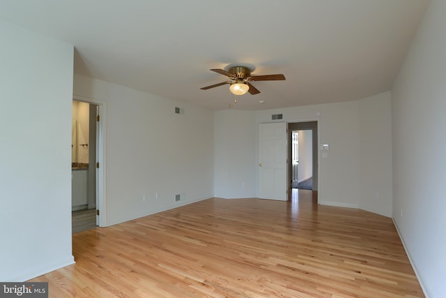 spare room with light hardwood / wood-style floors and ceiling fan