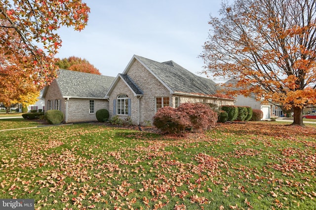 view of property exterior with a lawn