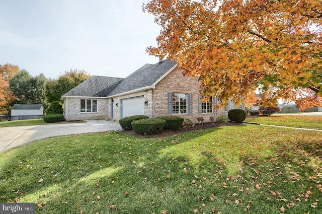 view of front of property featuring a front lawn and a garage