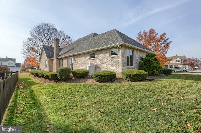 view of home's exterior featuring a lawn