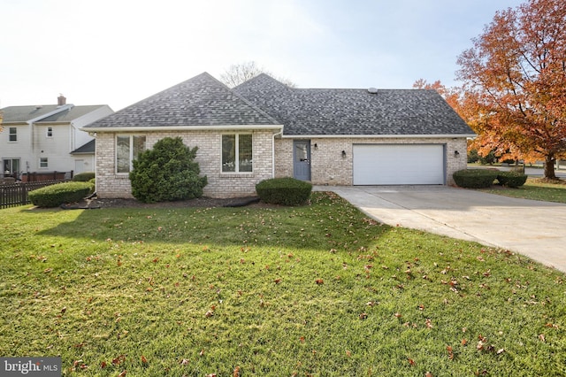 ranch-style home with a front yard and a garage