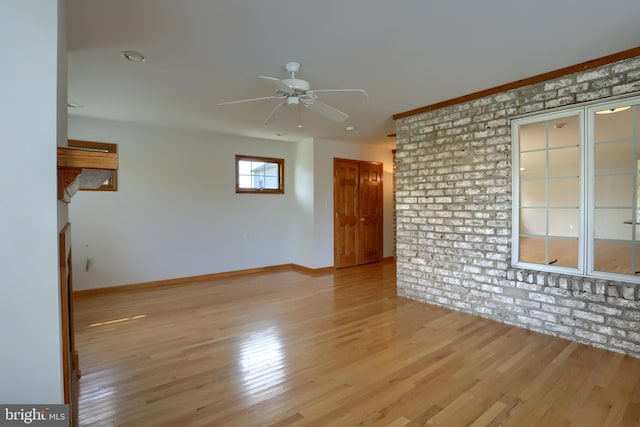 unfurnished room with light hardwood / wood-style flooring and ceiling fan