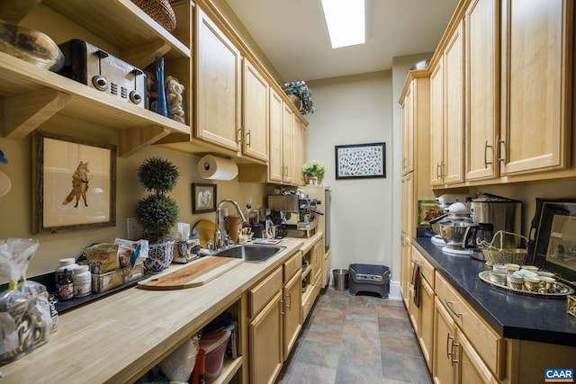 kitchen with sink and light brown cabinets